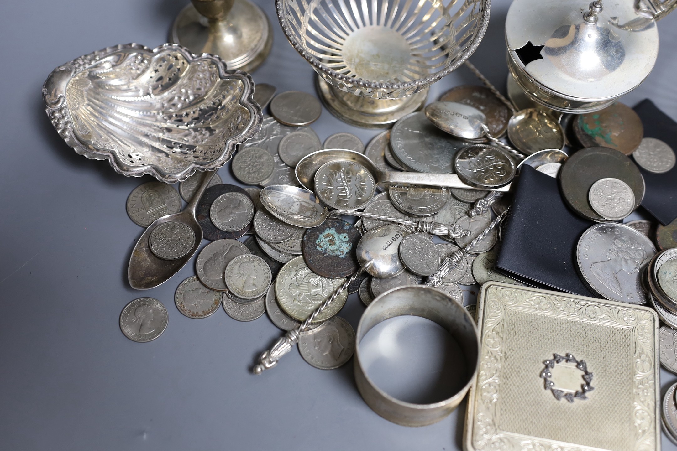 Mixed silver items including a pair of George V pierced silver bowls, weighted, a pair of pierced silver shell dishes, a pair of dwarf candlesticks, a silver napkin ring and other items including compact and assorted coi